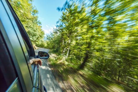 Car driving down road